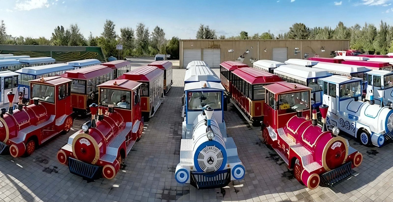 Sightseeing Train for Sale: 16–72 Seat Models & Real Prices Trackless sightseeing trains lined up in the JHRides factory yard in Kaifeng, China
