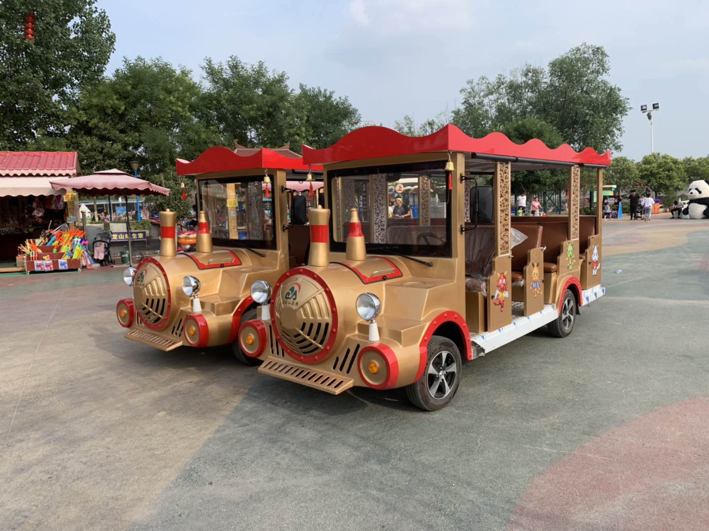 Sightseeing vehicles in operation at a tourist attraction with passengers