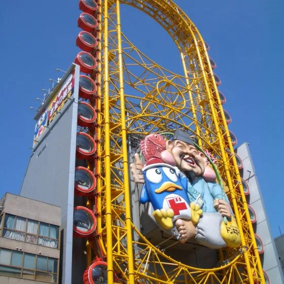 About 2002 Wheel On A Building.jpg 2 560x560 1