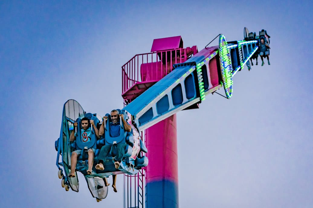 Crazy Dance amusement ride in operation at a theme park