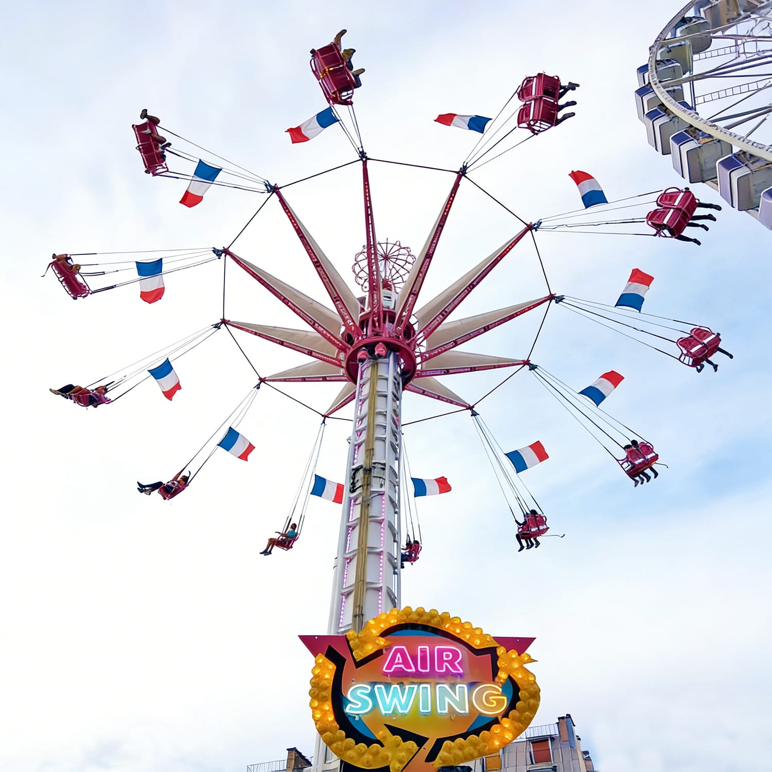 Flying Tower amusement ride in operation at a theme park