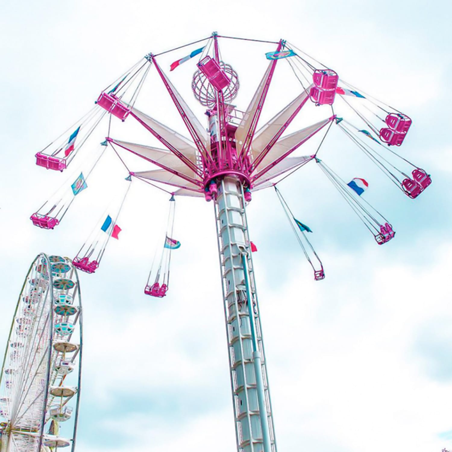 Flying Tower large amusement ride illuminated at dusk