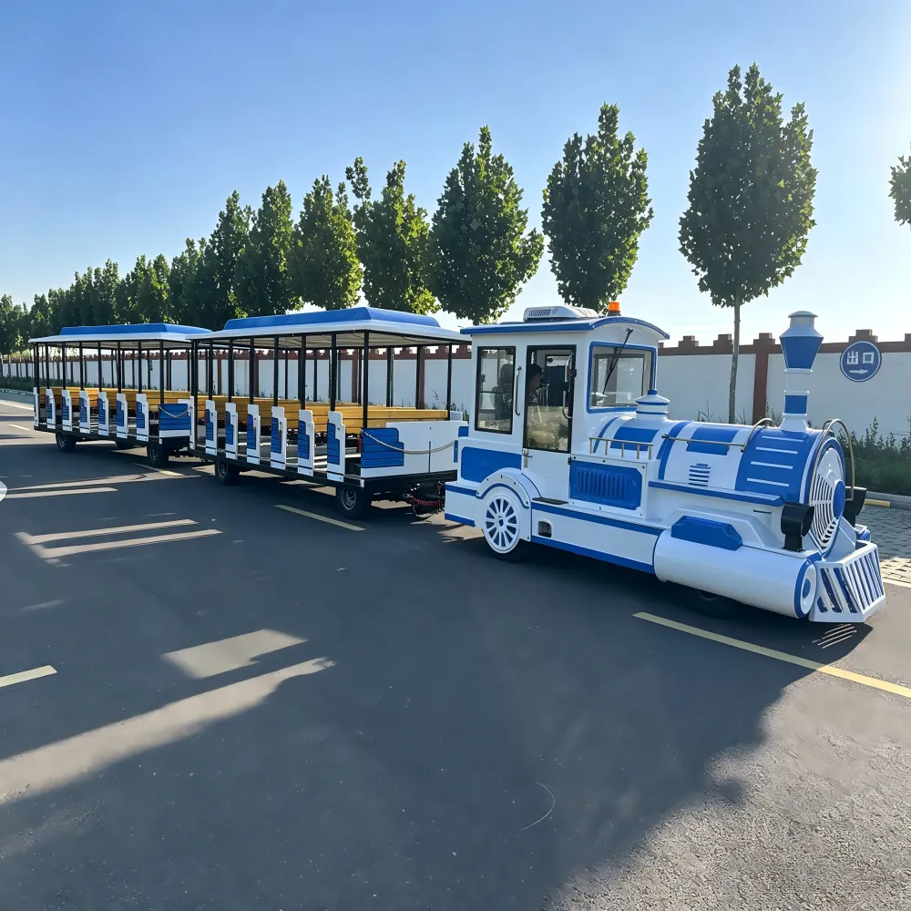 Trackless vs Track Train: Specs, Costs & How to Choose 72-seat trackless sightseeing train in blue and white on a test run on an asphalt road