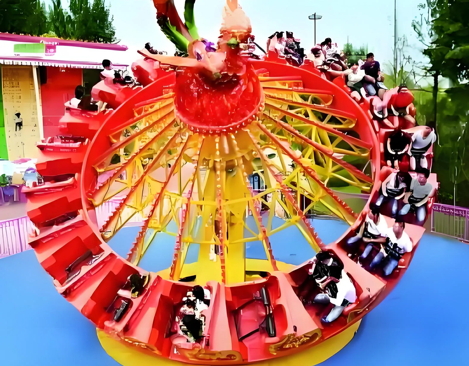 Flying turntable ride carrying a full load of riders at an outdoor park