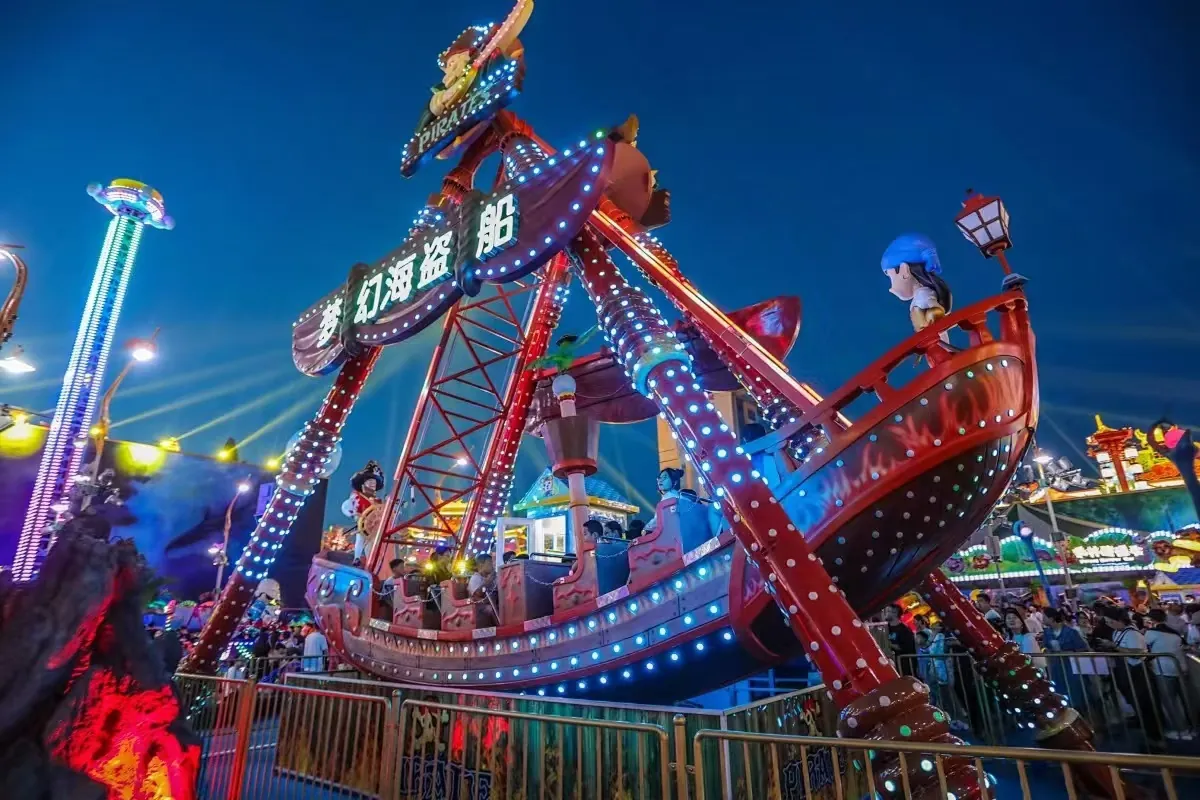 Pirate Ship Ride Manufacturer: Specs, Prices & CIF Cost Pirate ship ride running at night with LED lighting and full passenger load